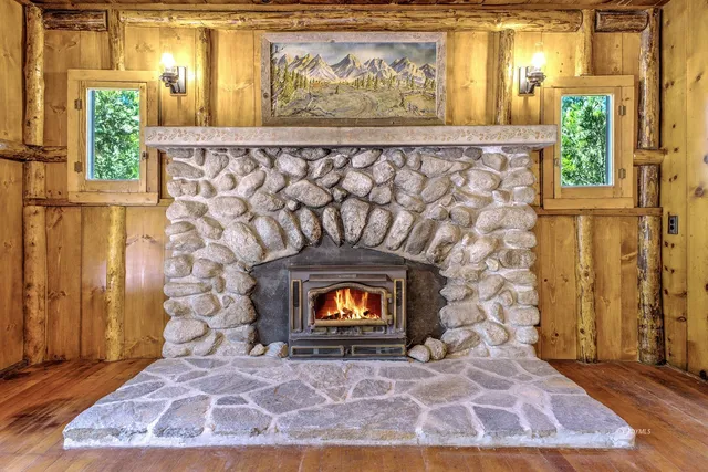 a view of a fireplace with wooden floor