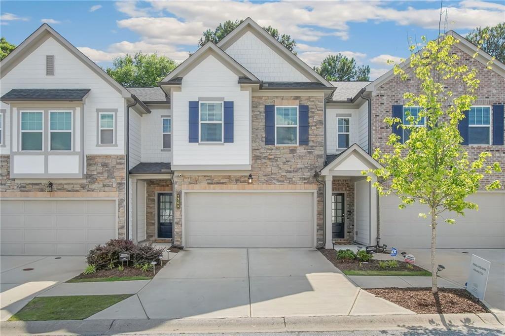 a front view of a house with garden
