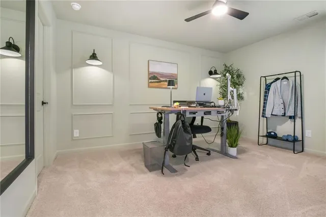 a view of a workspace with furniture