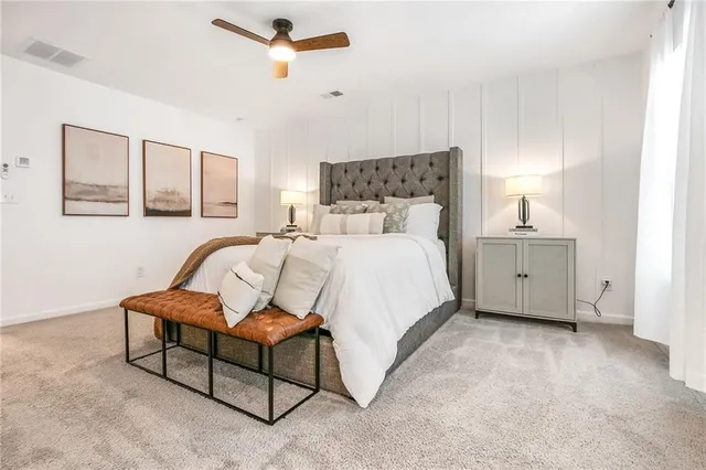 a bedroom with a bed and a couch