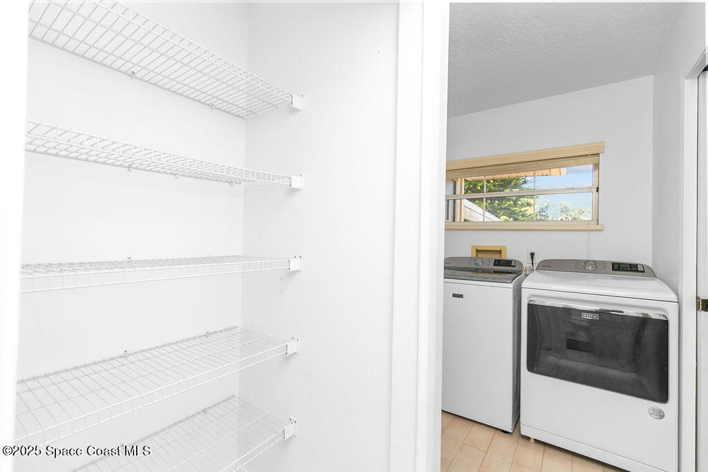 2524 Trotters Trail Cocoa, FL 32926 - Photo 15 of 46 a view of washer and dryer in a room