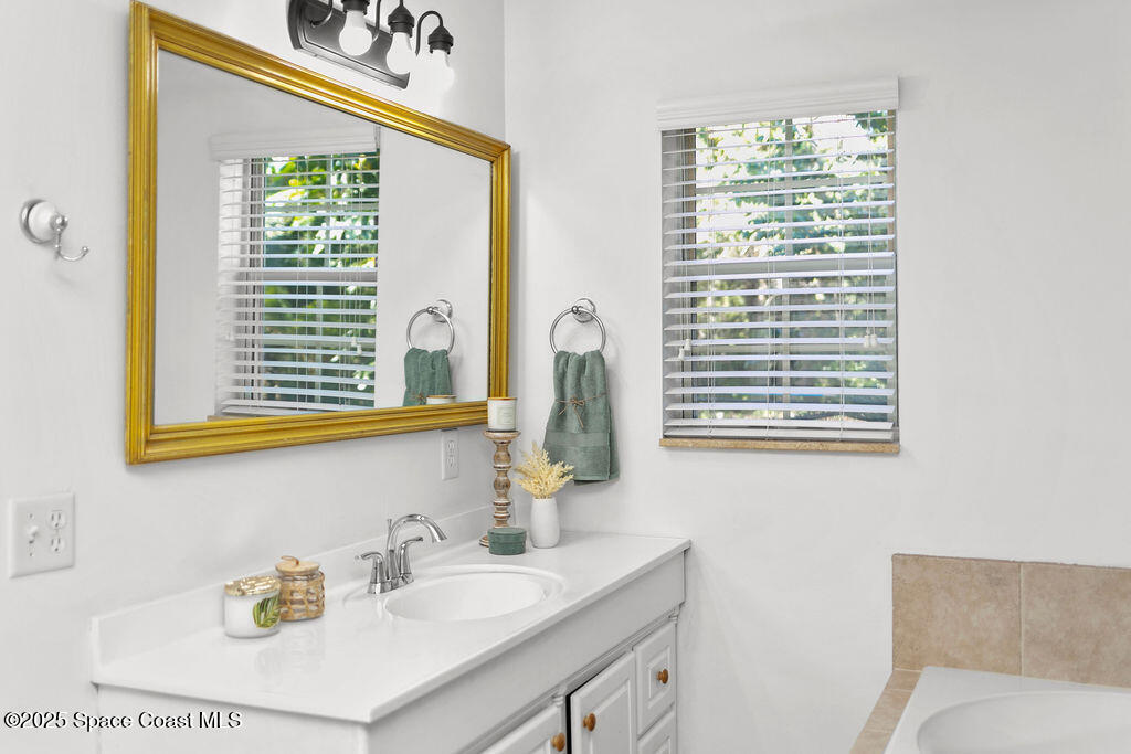 2524 Trotters Trail Cocoa, FL 32926 - Photo 20 of 46 a bathroom with a sink and a window