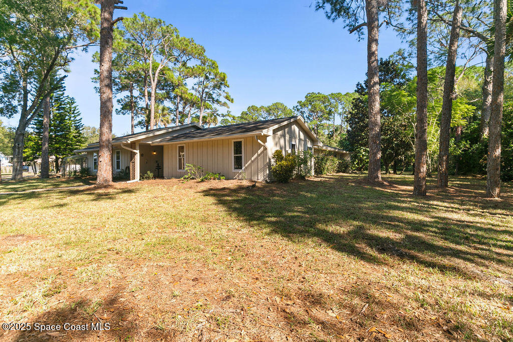 2524 Trotters Trail Cocoa, FL 32926 - Photo 38 of 46 a view of a house with a yard