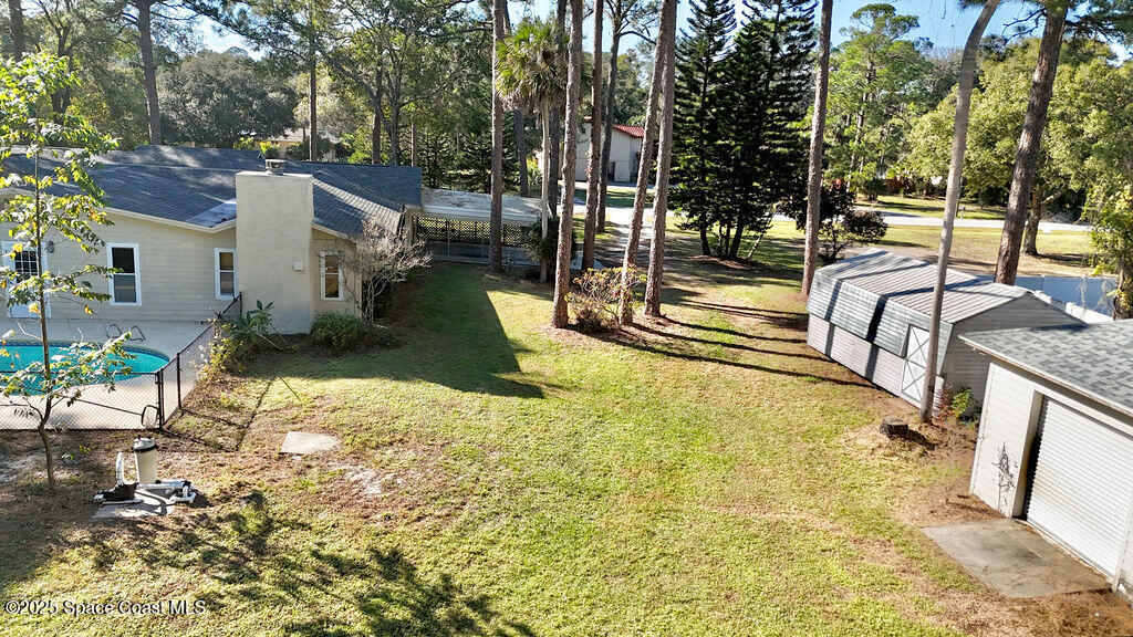 2524 Trotters Trail Cocoa, FL 32926 - Photo 39 of 46 a view of a swimming pool with a patio and backyard