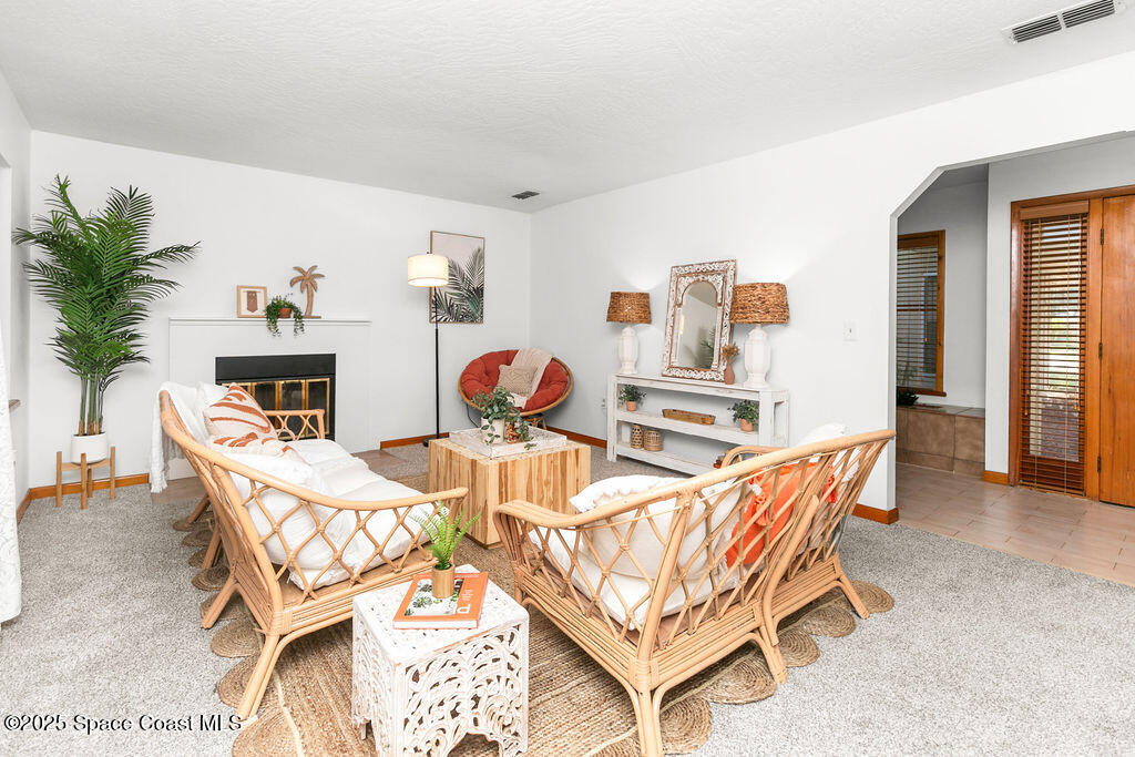 2524 Trotters Trail Cocoa, FL 32926 - Photo 8 of 46 a dining room with furniture and a wooden floor