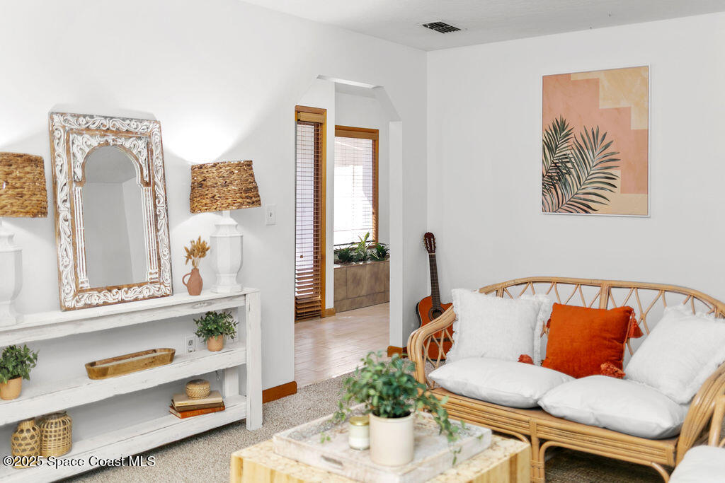 2524 Trotters Trail Cocoa, FL 32926 - Photo 9 of 46 a living room with furniture and a mirror
