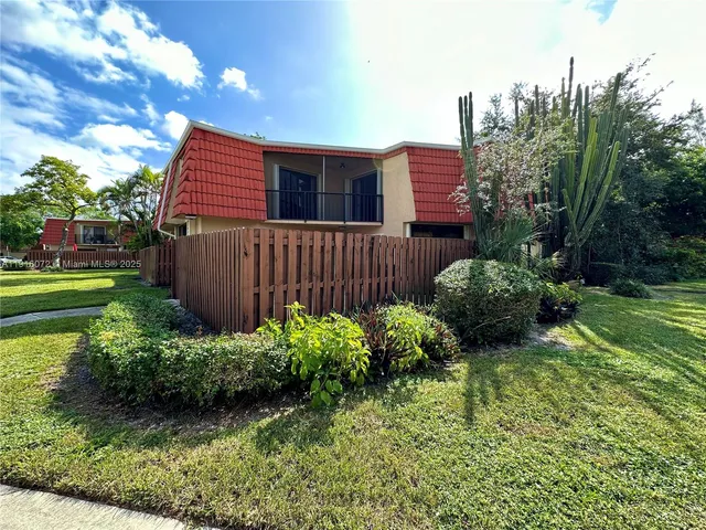 a view of a backyard with plants