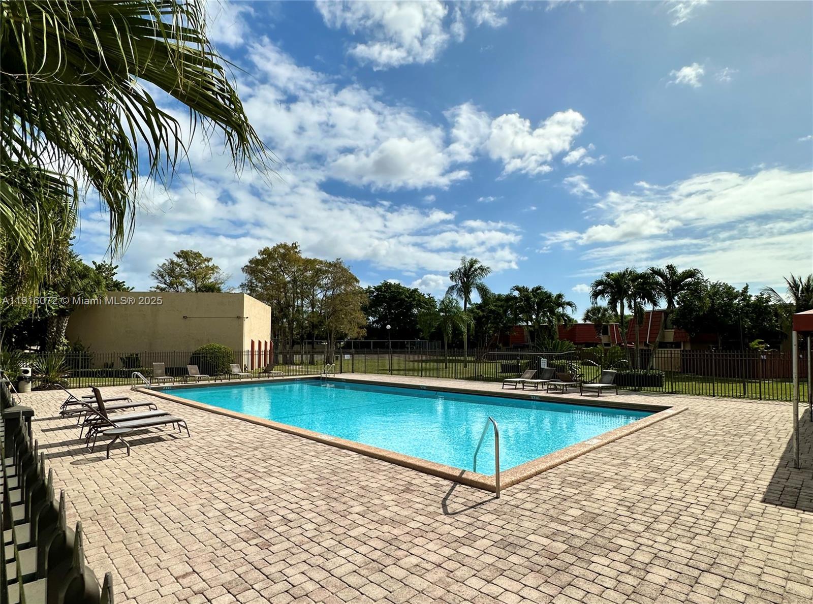 22970 Oxford Place, Unit A Boca Raton, FL 33433 - Photo 24 of 24 a view of a swimming pool with lounge chair
