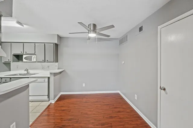 a view of a kitchen with a sink and dishwasher