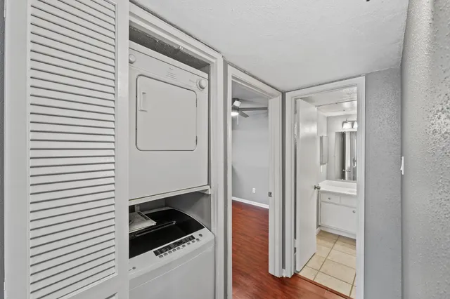a bathroom with a shower and a sink