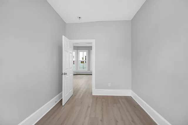 a view of wooden floor in an empty room