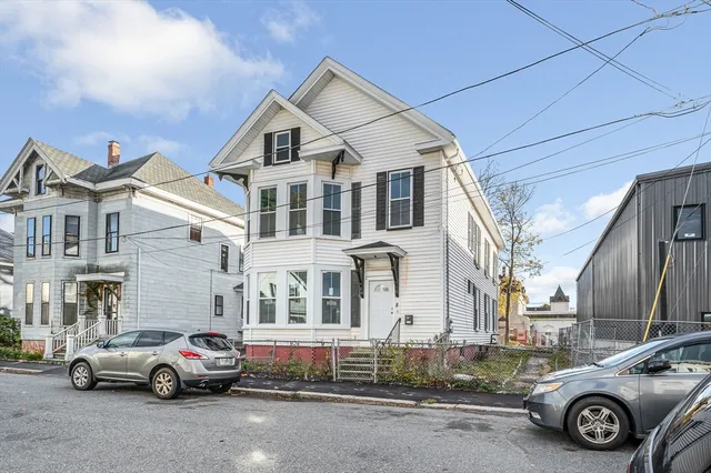 a car parked in front of a house