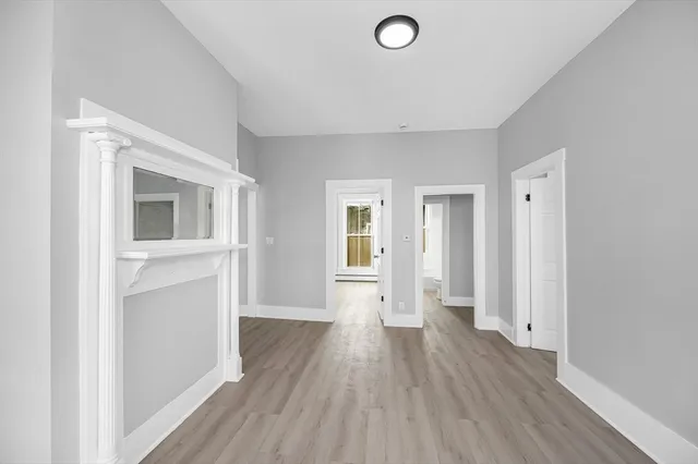 a view of a livingroom with wooden floor