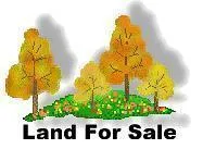 a front view of a multi story residential apartment building with a yard