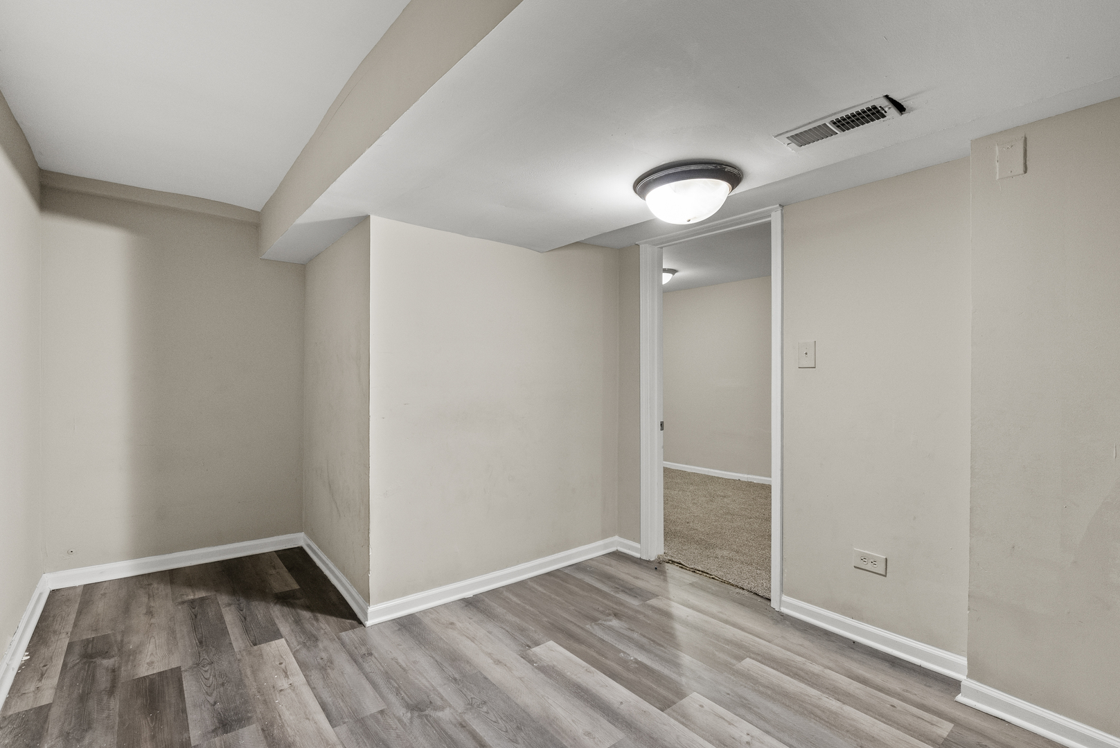 503 West 81st Street Chicago, IL 60620 - Photo 13 of 29 an empty room with wooden floor and windows