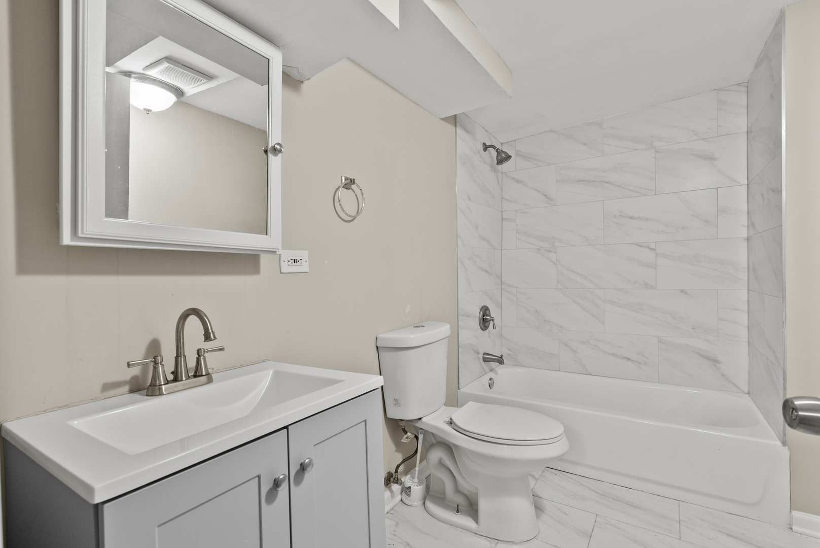 503 West 81st Street Chicago, IL 60620 - Photo 19 of 29 a bathroom with a sink a toilet and shower