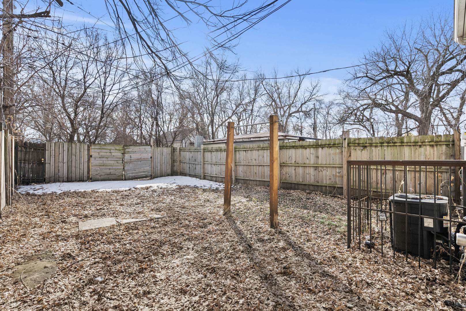 503 West 81st Street Chicago, IL 60620 - Photo 20 of 29 a view of a backyard with wooden fence