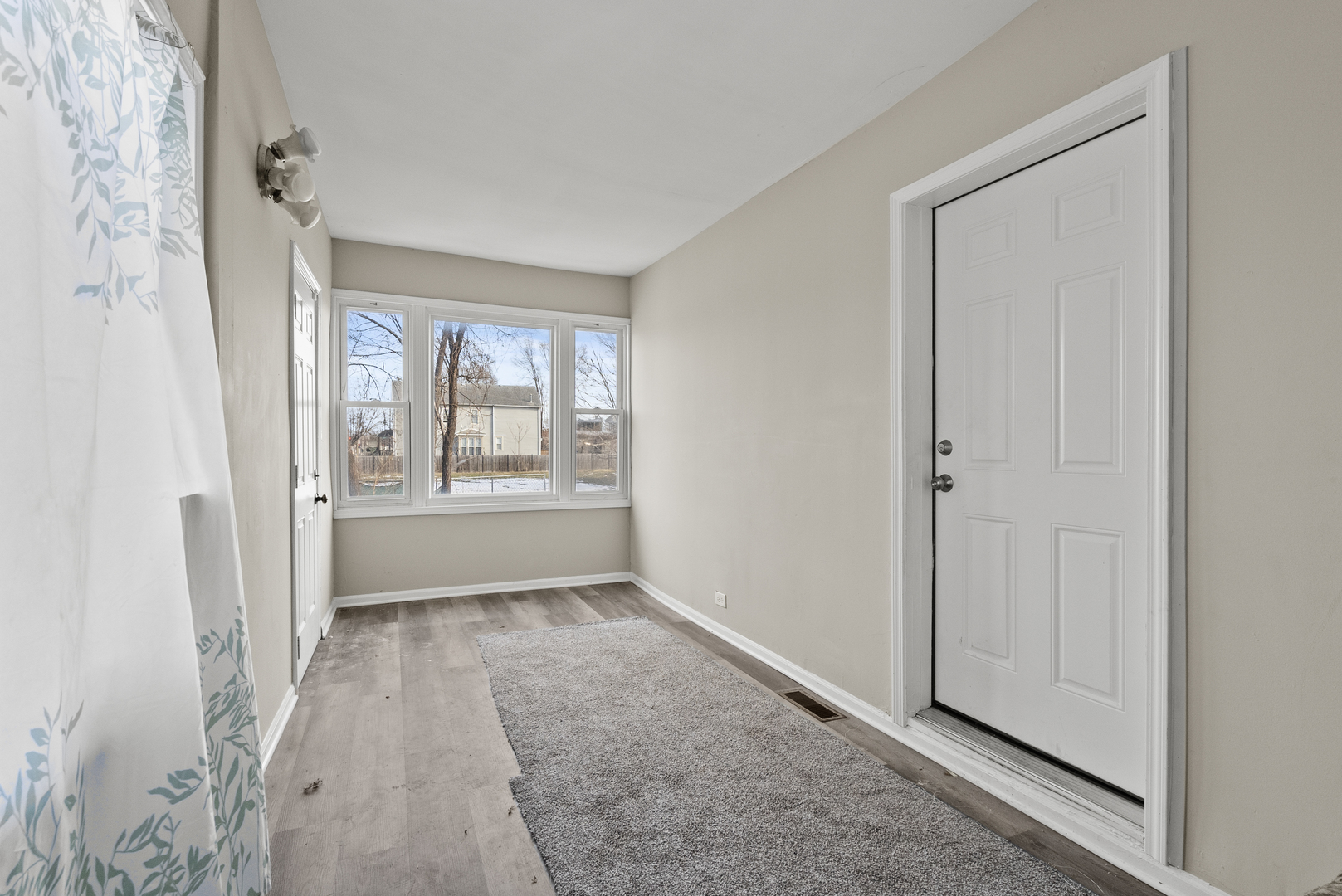 503 West 81st Street Chicago, IL 60620 - Photo 3 of 29 a view of an empty room with a window