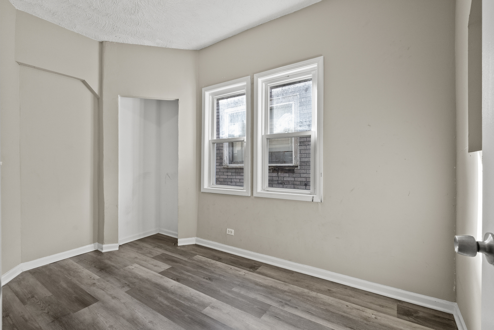 503 West 81st Street Chicago, IL 60620 - Photo 8 of 29 a view of empty room with wooden floor and fan