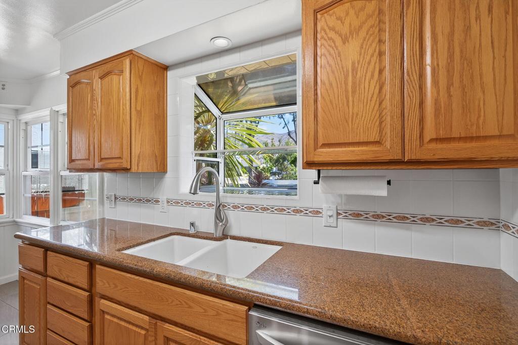 2418 Lexington Drive Ventura, CA 93003 - Photo 13 of 36 a kitchen with a sink and cabinets