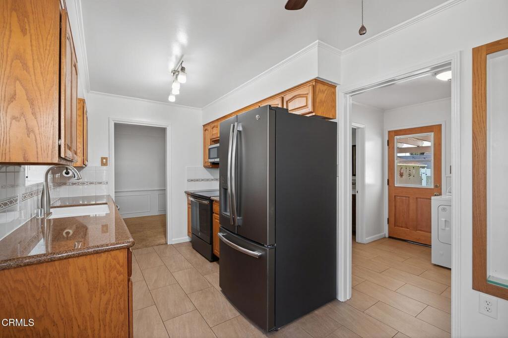 2418 Lexington Drive Ventura, CA 93003 - Photo 15 of 36 a kitchen with stainless steel appliances granite countertop a refrigerator and a sink