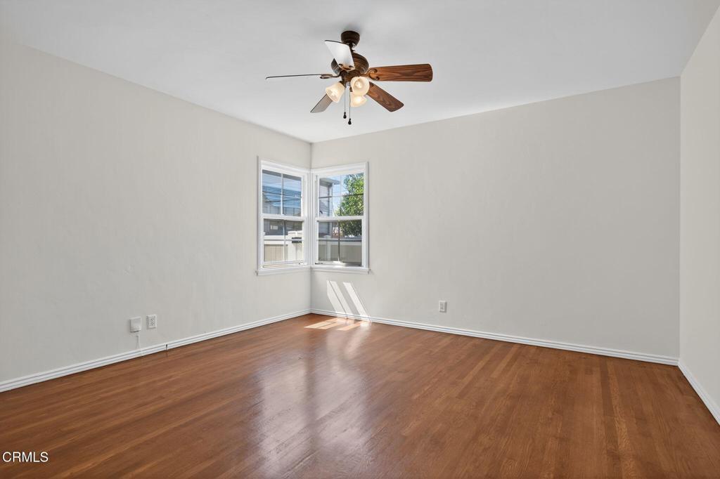 2418 Lexington Drive Ventura, CA 93003 - Photo 17 of 36 wooden floor in an empty room with a window
