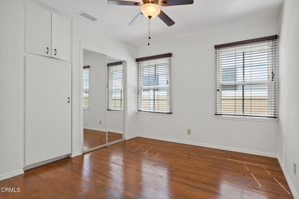 2418 Lexington Drive Ventura, CA 93003 - Photo 21 of 36 a view of an empty room with window and wooden floor