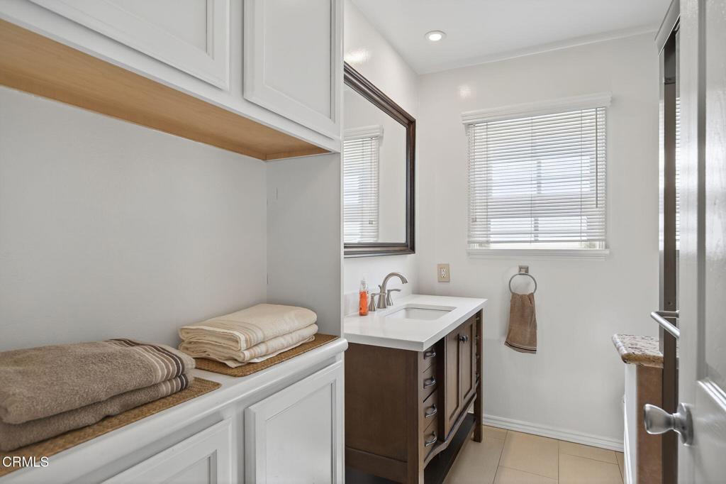 2418 Lexington Drive Ventura, CA 93003 - Photo 22 of 36 a utility room with a sink dryer and washer