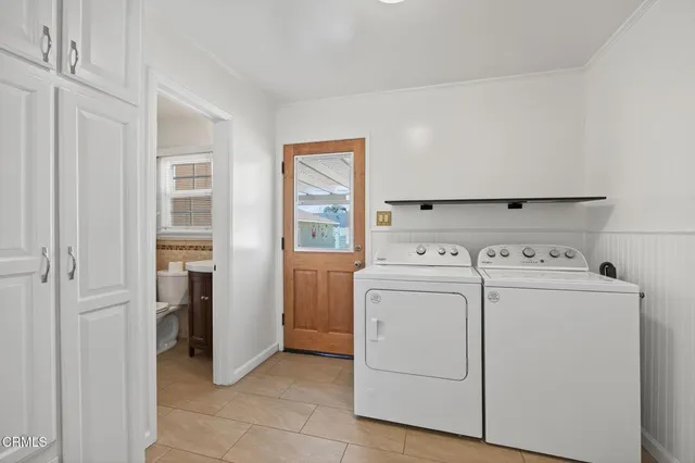 a bathroom with a granite countertop toilet a sink and a mirror