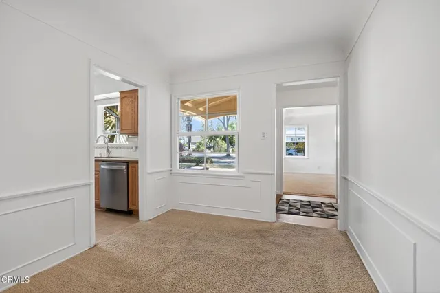 a kitchen with stainless steel appliances granite countertop a sink a stove and a refrigerator