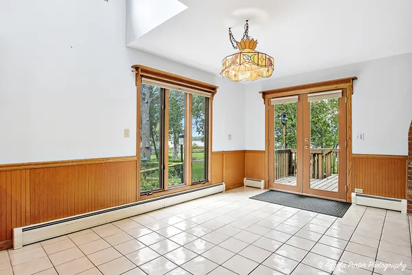 a view of an entryway with a chandelier