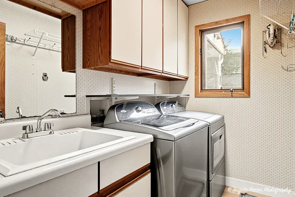 a bathroom with a sink and a window