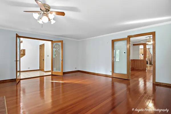 a view of an empty room with glass door