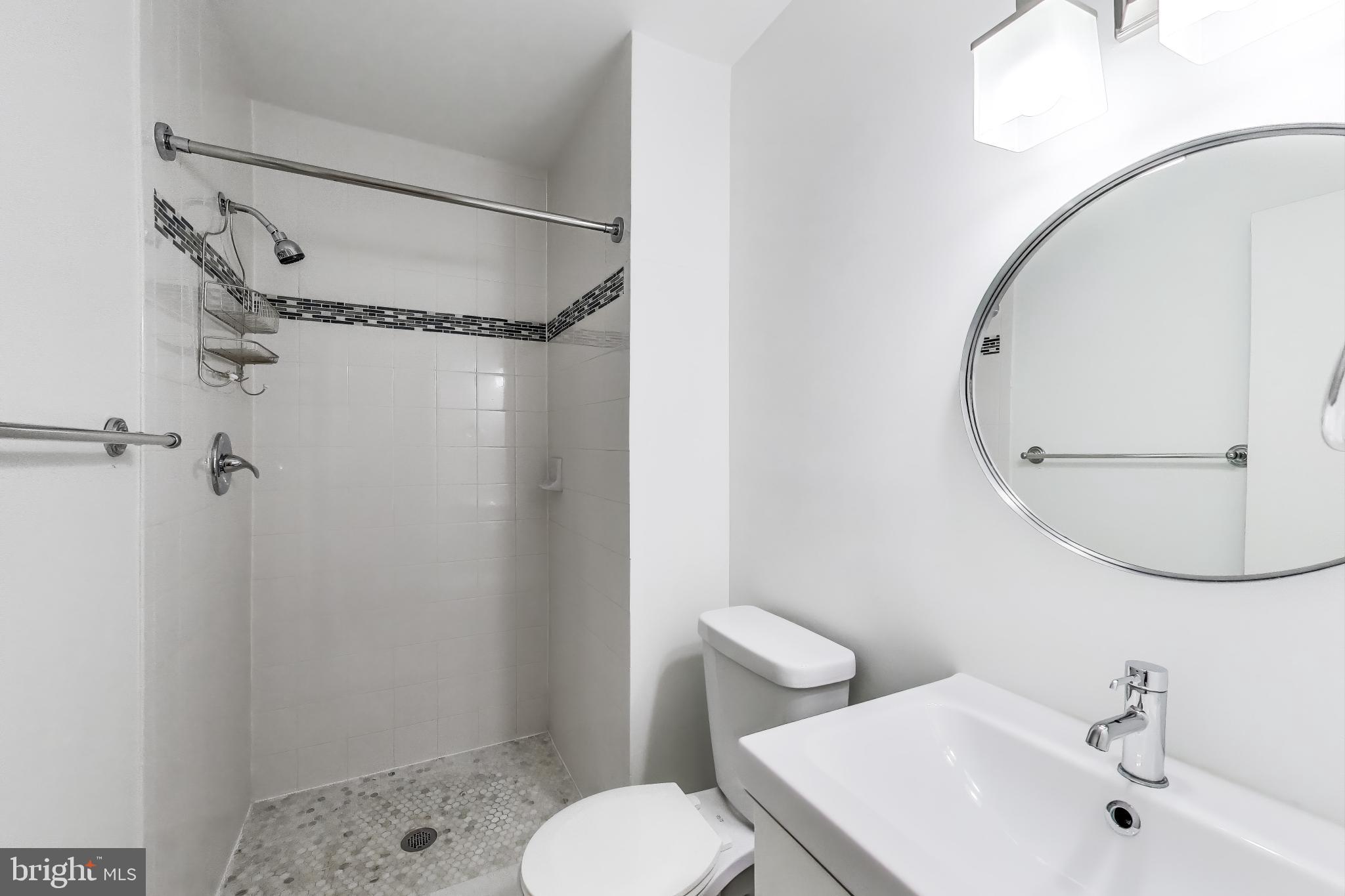 763 3rd Street Northeast Washington, DC 20002 - Photo 17 of 32 a bathroom with a sink toilet and shower