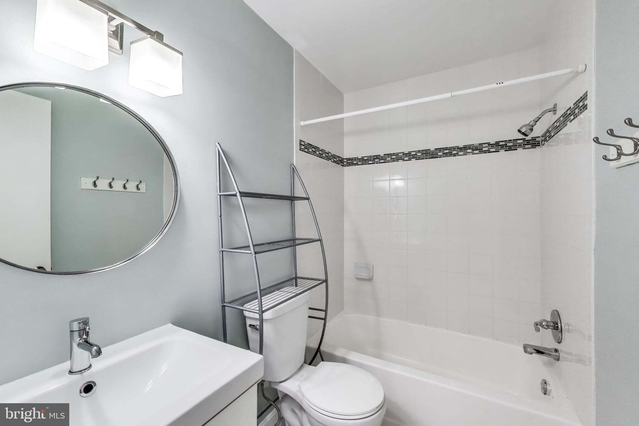 763 3rd Street Northeast Washington, DC 20002 - Photo 20 of 32 a bathroom with a sink toilet and shower