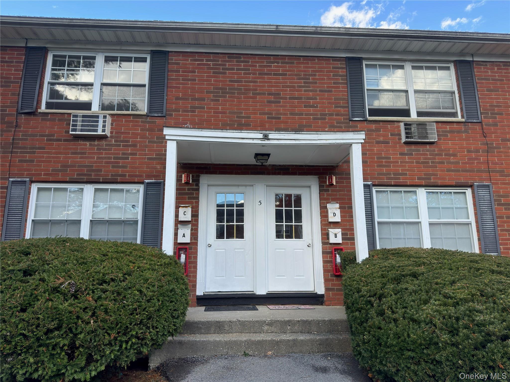 5 Wildwood Drive, Unit 5C Wappingers Falls, NY 12590 - Photo 2 of 11 a front view of a house