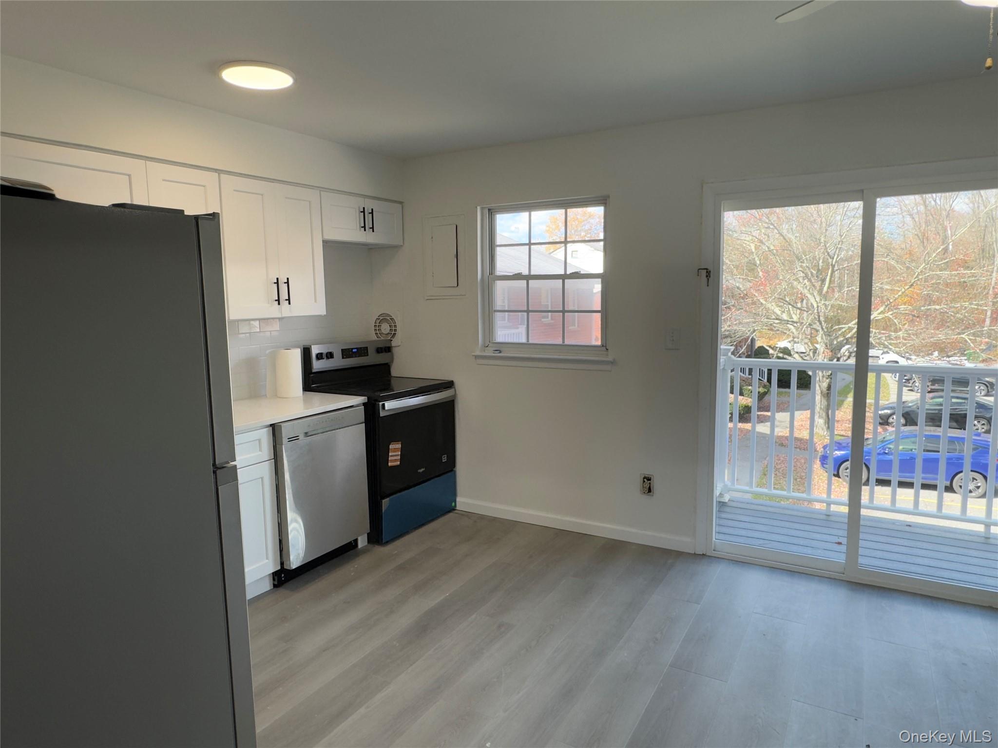 5 Wildwood Drive, Unit 5C Wappingers Falls, NY 12590 - Photo 3 of 11 a kitchen with a refrigerator and a sink