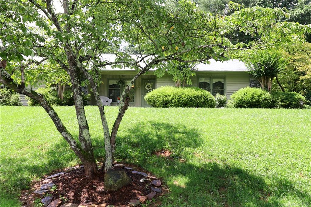 a view of a house with a garden