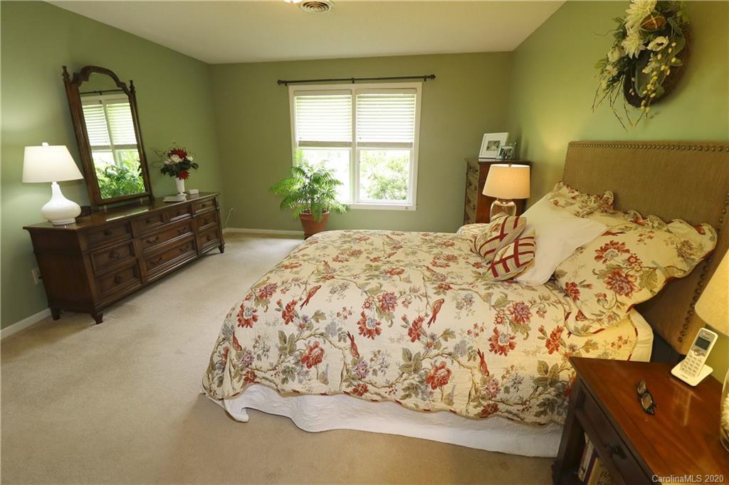 44 Jervey Road, Unit 2B Tryon, NC 28782 - Photo 17 of 24 a bedroom with a bed and window with mirror