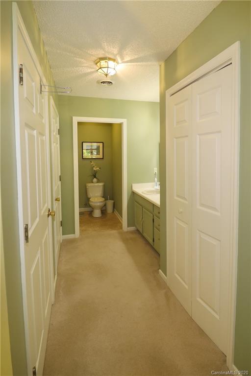 44 Jervey Road, Unit 2B Tryon, NC 28782 - Photo 21 of 24 a view of a bathroom with a sink and a mirror