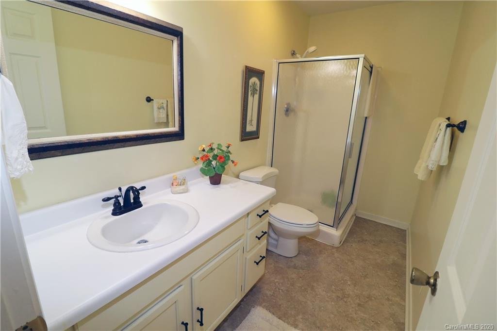 44 Jervey Road, Unit 2B Tryon, NC 28782 - Photo 24 of 24 a bathroom with a sink a toilet and mirror