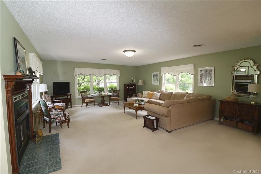 44 Jervey Road, Unit 2B Tryon, NC 28782 - Photo 7 of 24 a living room with furniture and a flat screen tv