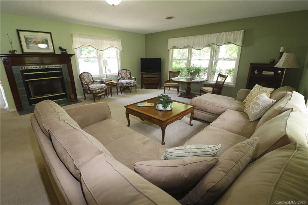 44 Jervey Road, Unit 2B Tryon, NC 28782 - Photo 9 of 24 a living room with furniture and a flat screen tv