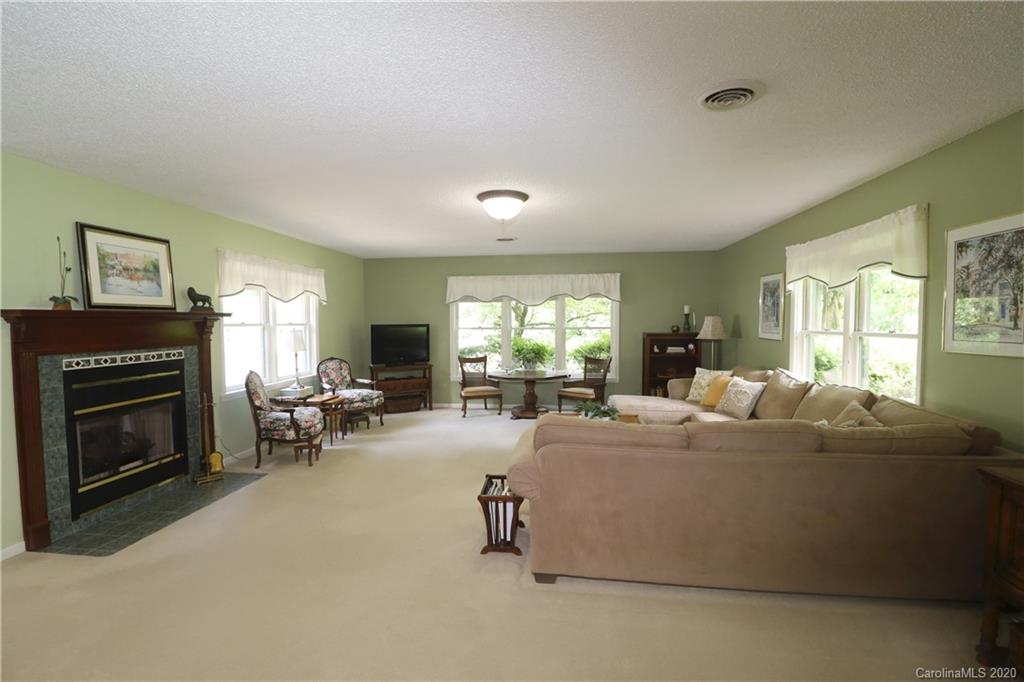 44 Jervey Road, Unit 2B Tryon, NC 28782 - Photo 10 of 24 a living room with furniture fireplace and window