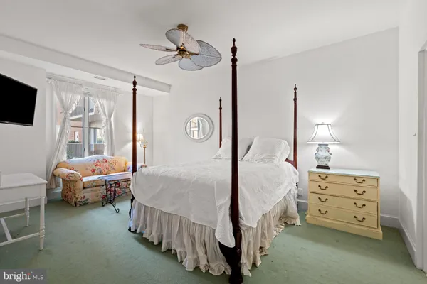 a bedroom with bed and a window