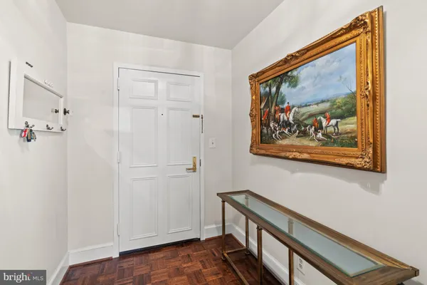 a view of a hallway with paintings on the wall