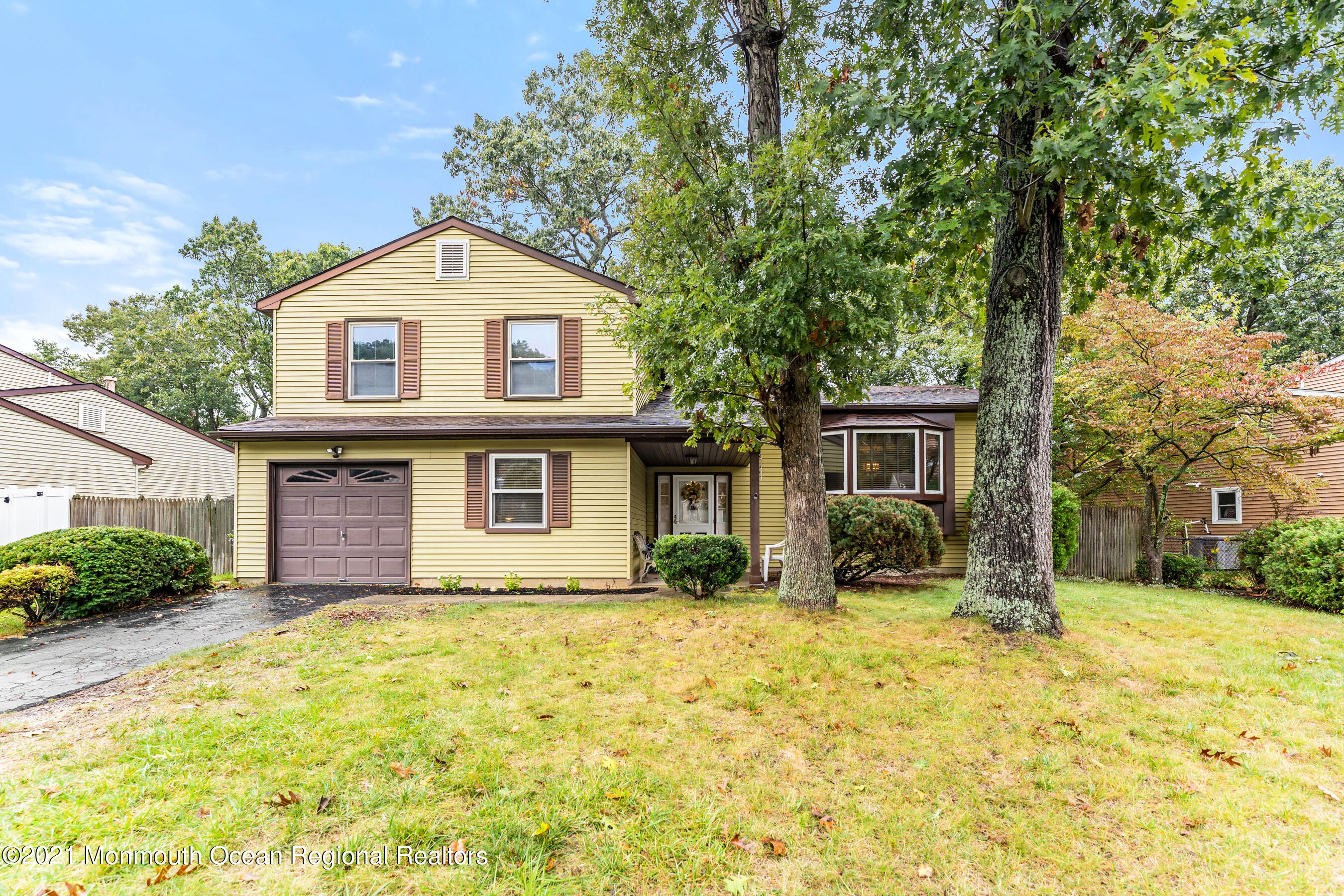a view of house with yard