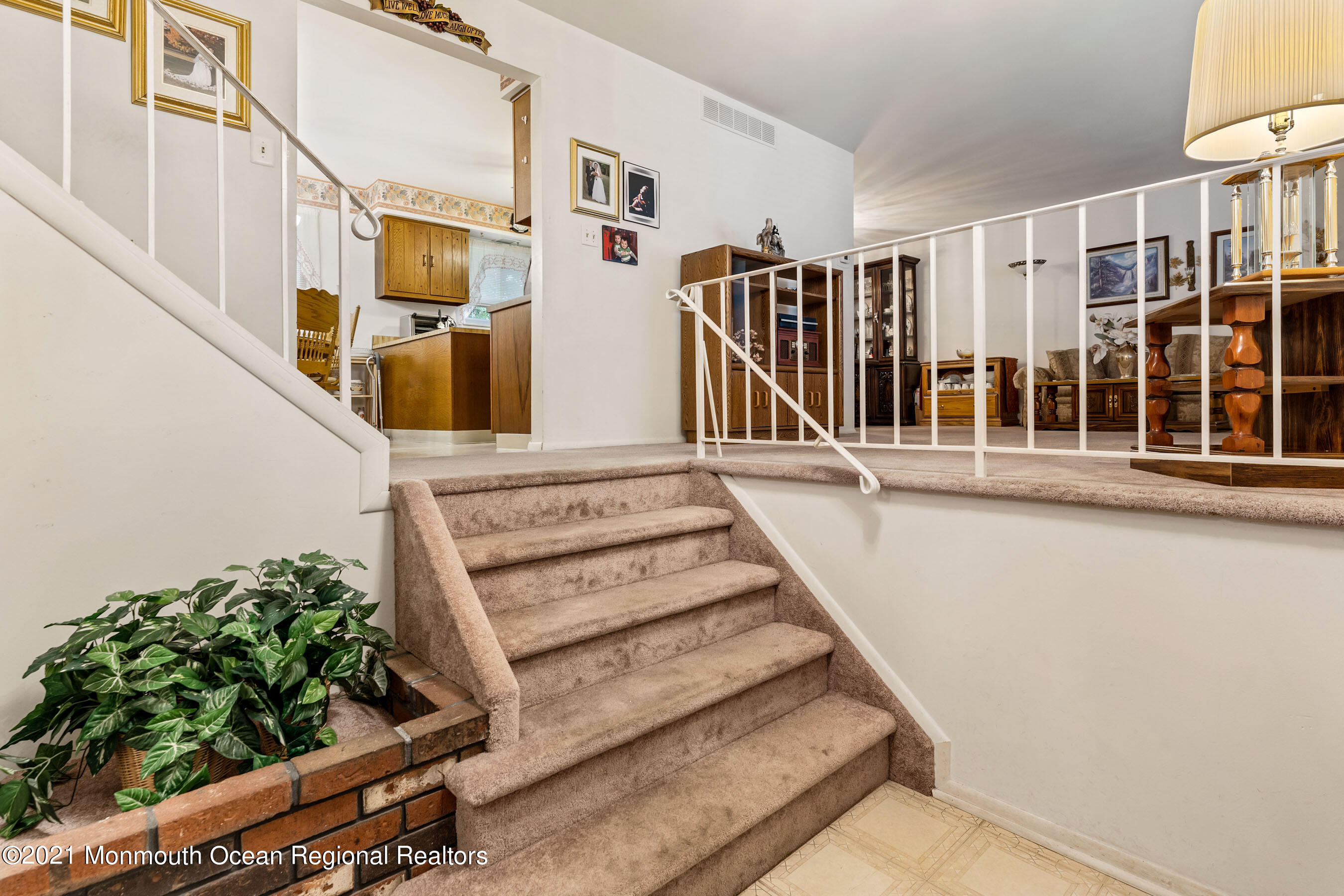 11 Flintlock Drive Howell, NJ 07731 - Photo 11 of 29 a view of a balcony with wooden floor and fence