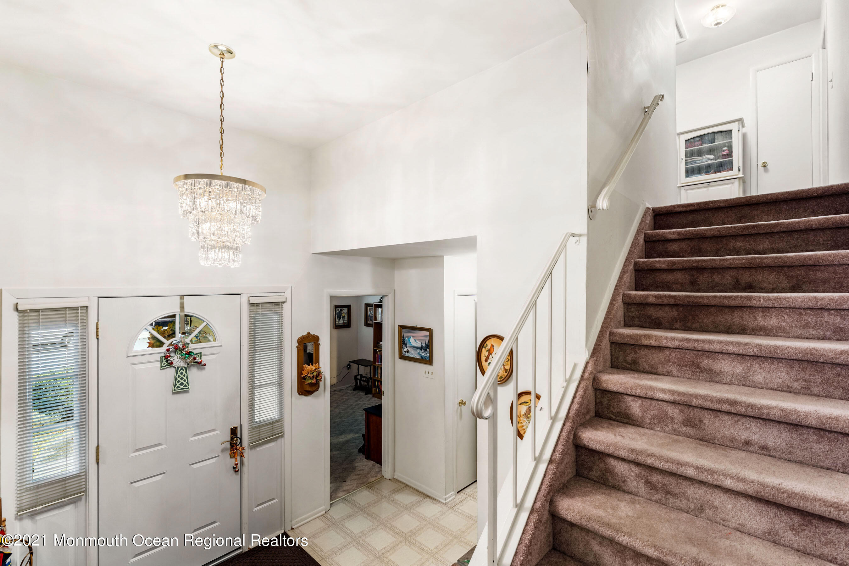 11 Flintlock Drive Howell, NJ 07731 - Photo 12 of 29 a view of a hallway with wooden floor and stairs
