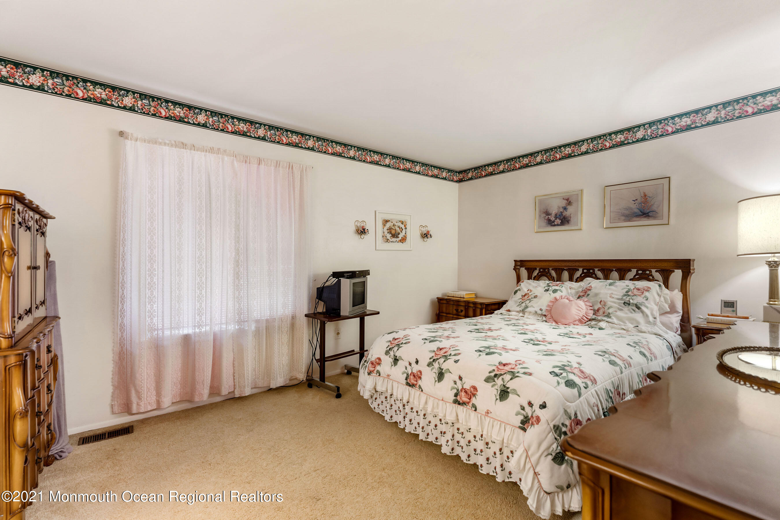 11 Flintlock Drive Howell, NJ 07731 - Photo 17 of 29 a bedroom with a bed and a window